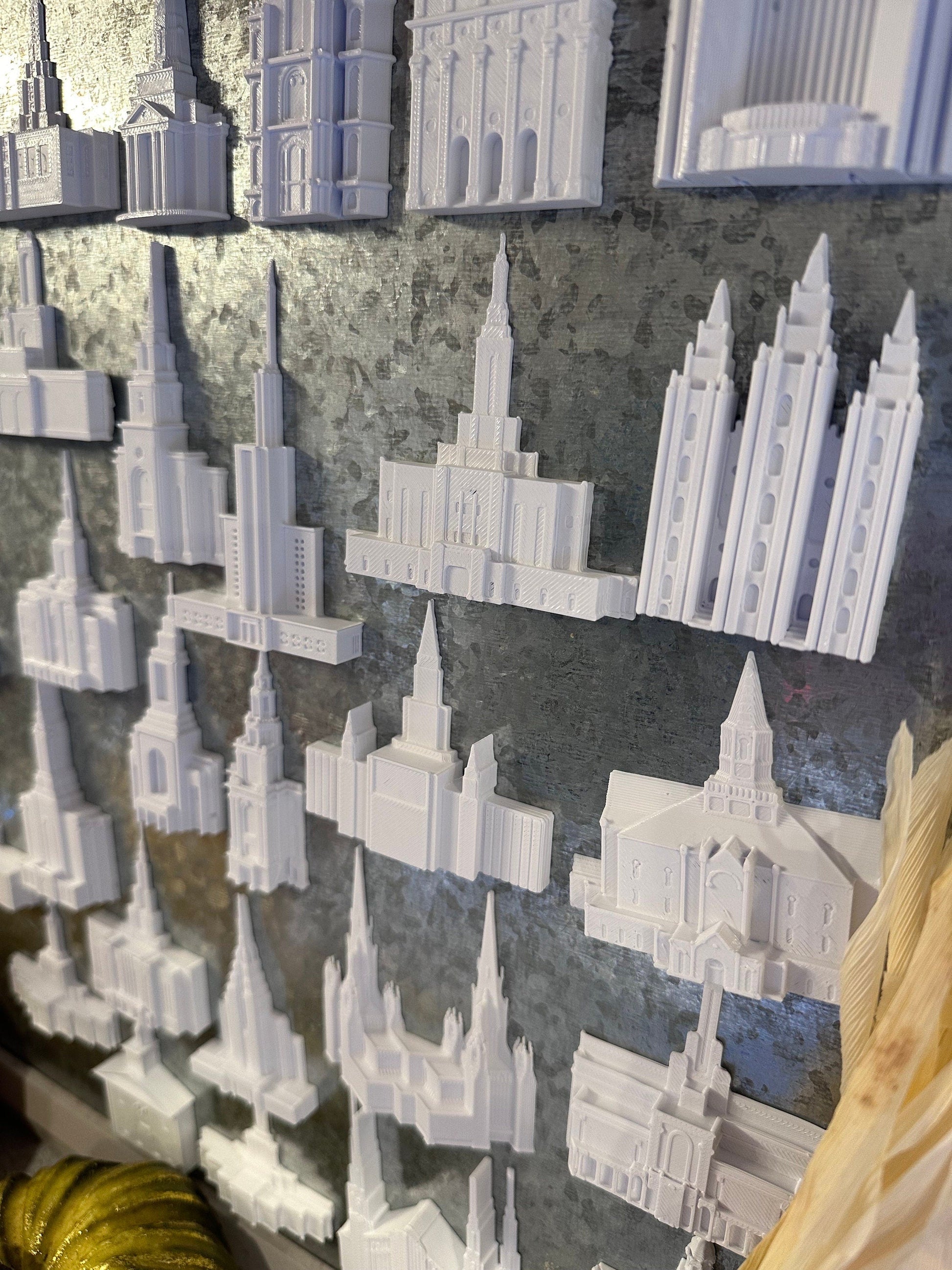 multiple temple magnets on a tin board